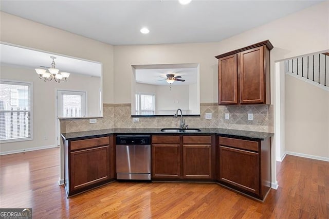 1957 Brightleaf Way Unit 59, Marietta, GA 30060 - kitchen featuring a sink, stainless steel dishwasher, light wood-style floors, and tasteful backsplash