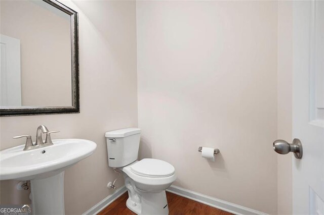 1957 Brightleaf Way Unit 59, Marietta, GA 30060 - bathroom with baseboards, wood finished floors, toilet, and a sink
