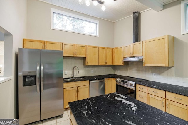 kitchen featuring stainless steel appliances, a sink, light brown cabinetry, under cabinet range hood, and wooden ceiling
