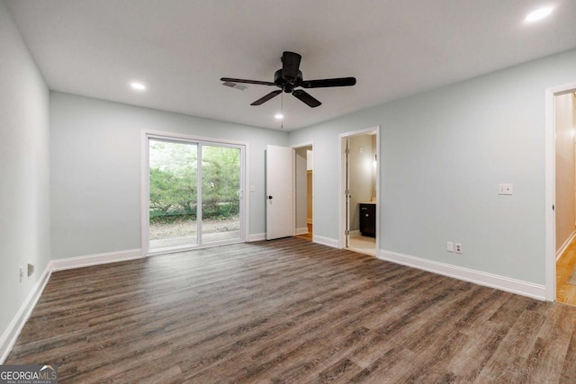 unfurnished bedroom featuring access to outside, wood finished floors, baseboards, recessed lighting, and ensuite bathroom