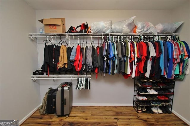 454 Primrose Ln, Pendergrass, GA 30567 - walk in closet featuring wood finished floors