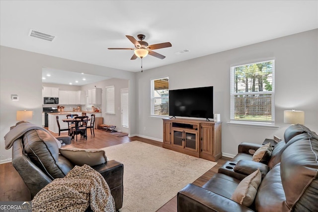 48 Sweetgum Trce, Dallas, GA 30132 - living room featuring ceiling fan, light wood-style floors, baseboards, and recessed lighting
