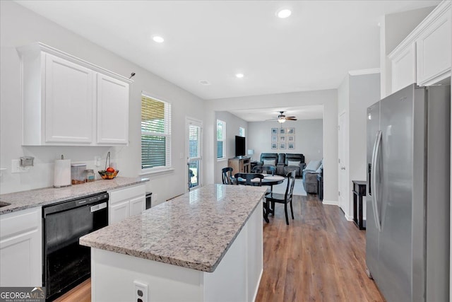 48 Sweetgum Trce, Dallas, GA 30132 - kitchen featuring stainless steel refrigerator with ice dispenser, black dishwasher, white cabinetry, a ceiling fan, and a center island