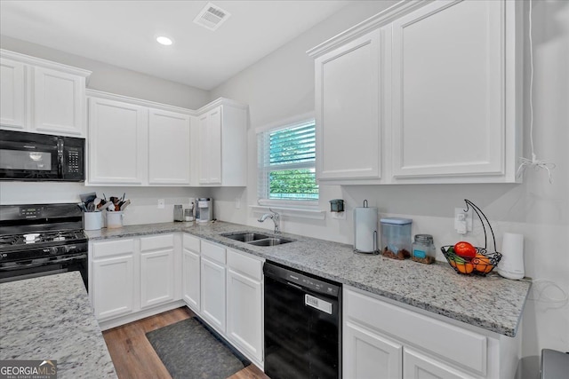 48 Sweetgum Trce, Dallas, GA 30132 - kitchen with black appliances, a sink, white cabinetry, light wood-style flooring, and recessed lighting