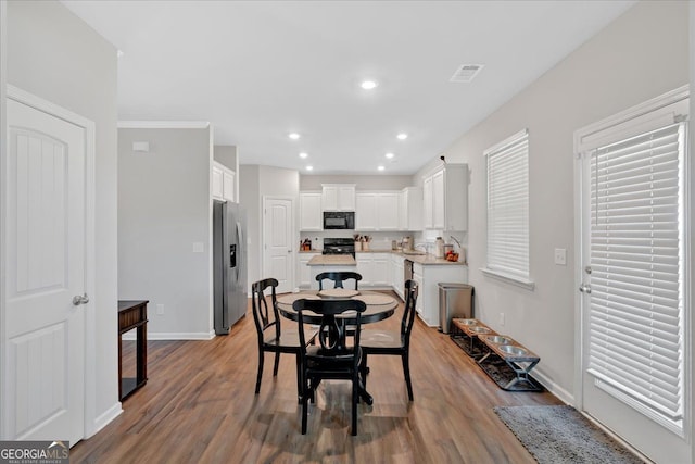 48 Sweetgum Trce, Dallas, GA 30132 - dining room featuring light wood-type flooring, baseboards, and recessed lighting