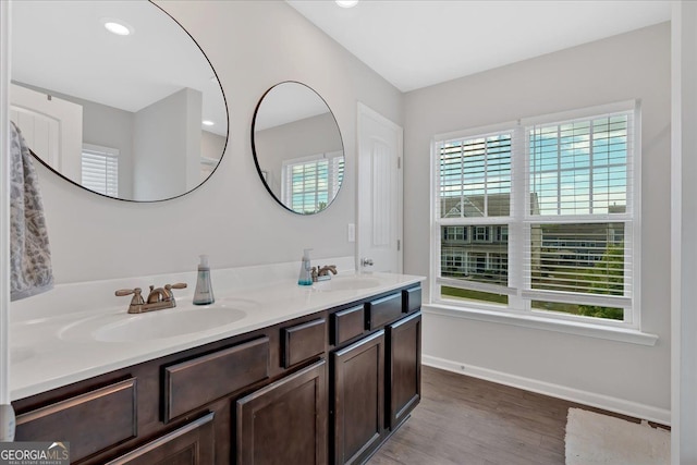 48 Sweetgum Trce, Dallas, GA 30132 - full bathroom with wood finished floors, double vanity, and baseboards