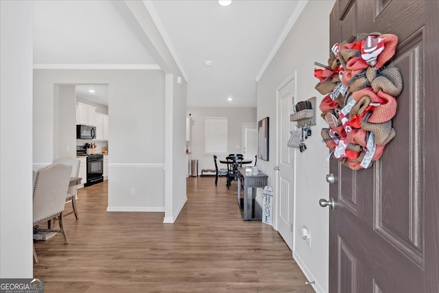 48 Sweetgum Trce, Dallas, GA 30132 - foyer entrance featuring crown molding, baseboards, light wood-type flooring, recessed lighting, and radiator