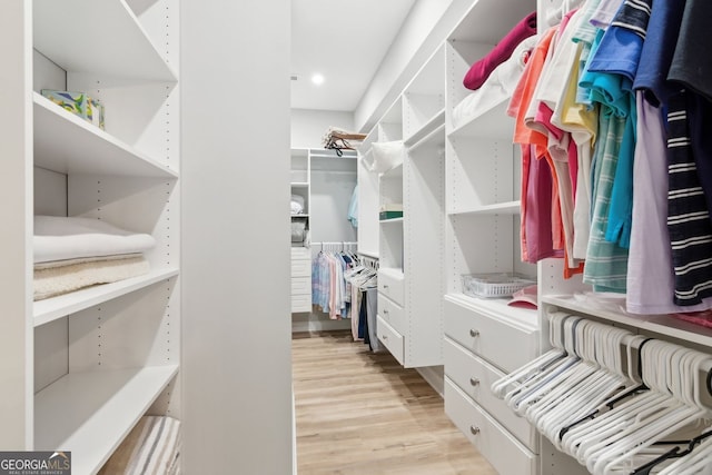 2470 Crimson Downs Dr, Cumming, GA 30040 - walk in closet featuring light wood-style flooring