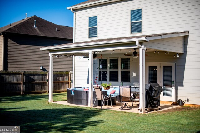 rear view of house with a patio and a ceiling fan