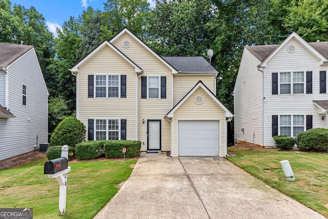 26 Springbottom Dr, Lawrenceville, GA 30046 - traditional home with a garage, a front yard, concrete driveway, and central air condition unit