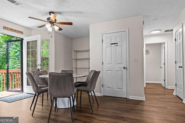 26 Springbottom Dr, Lawrenceville, GA 30046 - dining room with wood finished floors, ceiling fan, baseboards, and a textured ceiling