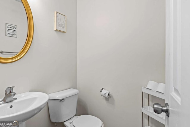 26 Springbottom Dr, Lawrenceville, GA 30046 - bathroom with a sink, toilet, and baseboards