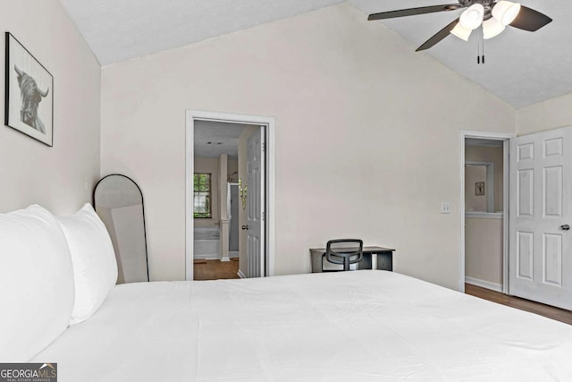 26 Springbottom Dr, Lawrenceville, GA 30046 - bedroom with vaulted ceiling, ensuite bathroom, wood finished floors, and a ceiling fan