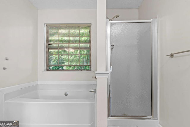 26 Springbottom Dr, Lawrenceville, GA 30046 - bathroom featuring a stall shower, a garden tub, and a textured ceiling
