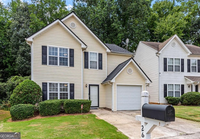 26 Springbottom Dr, Lawrenceville, GA 30046 - view of front of home featuring an attached garage, concrete driveway, and a front lawn