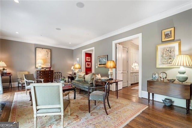 122 Old Ivy Rd NE Unit 17, Atlanta, GA 30342 - living area featuring wood finished floors, crown molding, recessed lighting, and baseboards