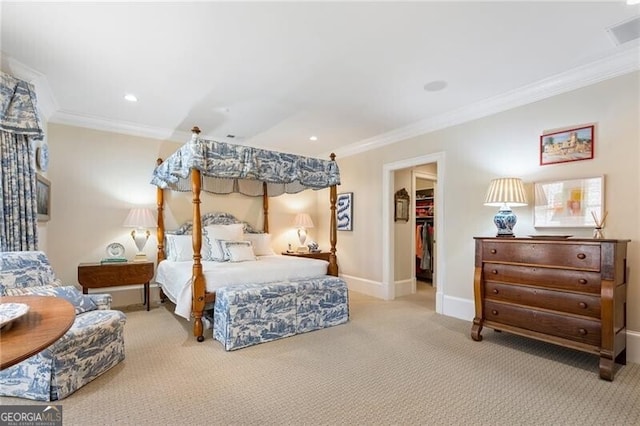 122 Old Ivy Rd NE Unit 17, Atlanta, GA 30342 - bedroom featuring ornamental molding, carpet flooring, a walk in closet, baseboards, and recessed lighting