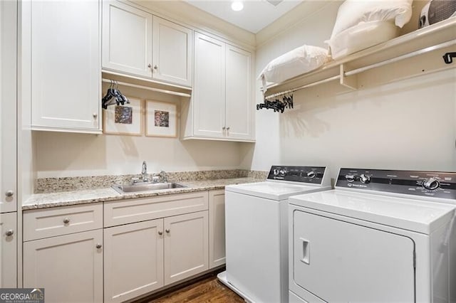 122 Old Ivy Rd NE Unit 17, Atlanta, GA 30342 - laundry room with cabinet space, washer and dryer, and dark wood finished floors