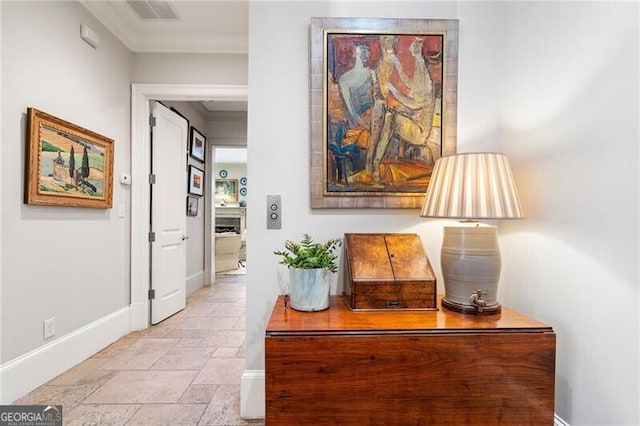 122 Old Ivy Rd NE Unit 17, Atlanta, GA 30342 - hall with stone tile flooring, baseboards, and ornamental molding