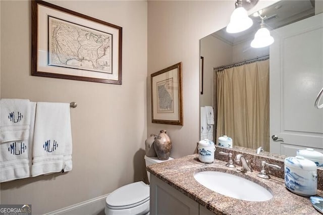 122 Old Ivy Rd NE Unit 17, Atlanta, GA 30342 - bathroom featuring vanity, toilet, and a shower with curtain
