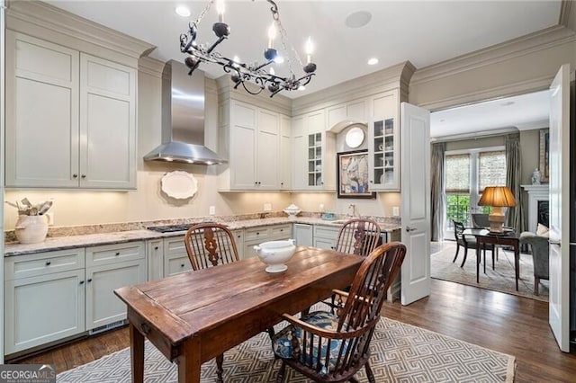 122 Old Ivy Rd NE Unit 17, Atlanta, GA 30342 - dining room with a chandelier, dark wood-style flooring, ornamental molding, and recessed lighting