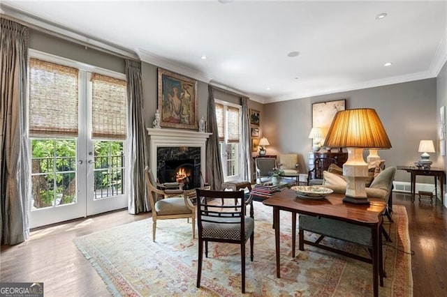 122 Old Ivy Rd NE Unit 17, Atlanta, GA 30342 - living area featuring ornamental molding, wood finished floors, french doors, a high end fireplace, and recessed lighting