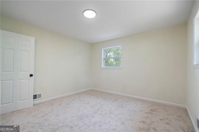 8432 Magnolia Dr, Jonesboro, GA 30238 - carpeted empty room with baseboards