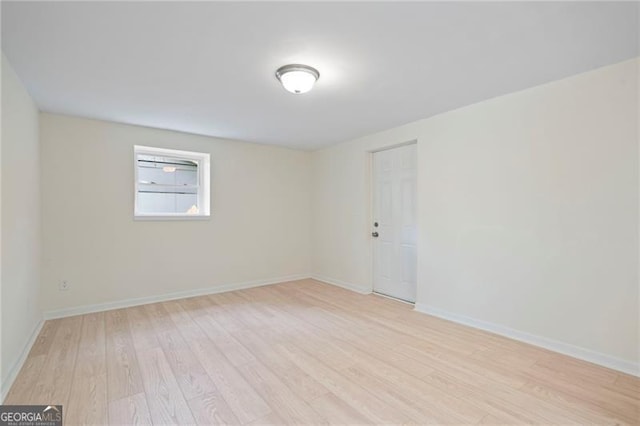 8432 Magnolia Dr, Jonesboro, GA 30238 - spare room featuring light wood-type flooring and baseboards