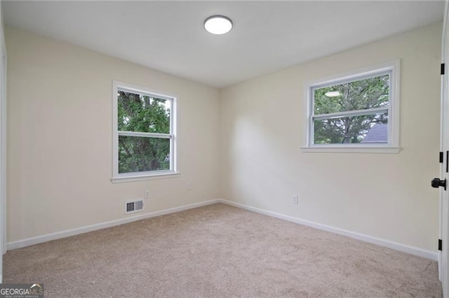 8432 Magnolia Dr, Jonesboro, GA 30238 - unfurnished room with carpet floors, plenty of natural light, and baseboards