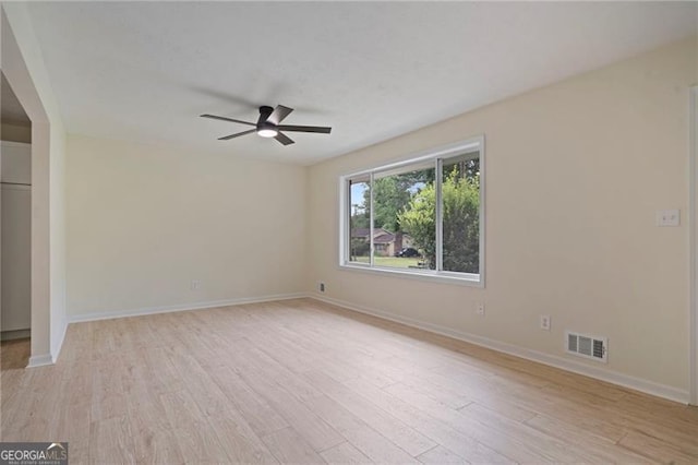 8432 Magnolia Dr, Jonesboro, GA 30238 - empty room featuring a ceiling fan, light wood finished floors, and baseboards