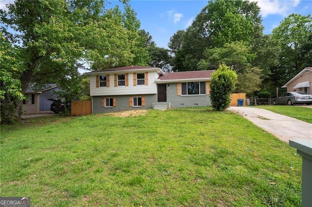 8432 Magnolia Dr, Jonesboro, GA 30238 - tri-level home featuring driveway and a front lawn