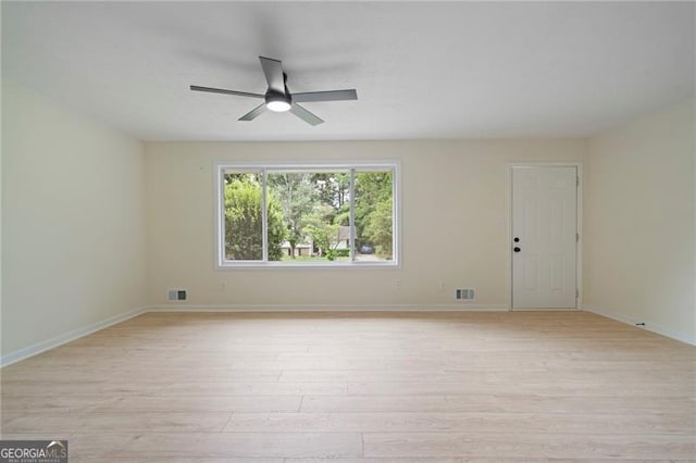 8432 Magnolia Dr, Jonesboro, GA 30238 - spare room with light wood finished floors, a ceiling fan, and baseboards