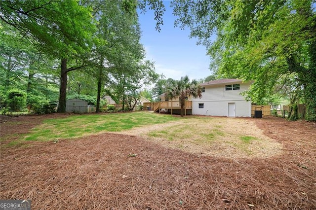 8432 Magnolia Dr, Jonesboro, GA 30238 - view of yard with a deck and fence