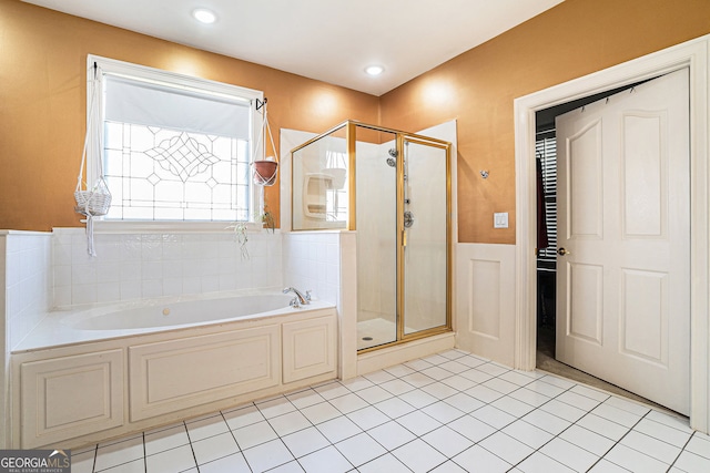 725 Windsor Place Cir SW, Grayson, GA 30017 - bathroom with a garden tub, a stall shower, a wainscoted wall, tile patterned floors, and recessed lighting