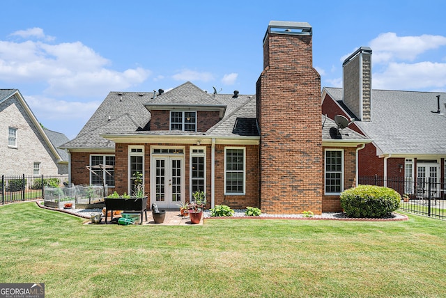 725 Windsor Place Cir SW, Grayson, GA 30017 - rear view of house with french doors, a chimney, brick siding, and roof with shingles
