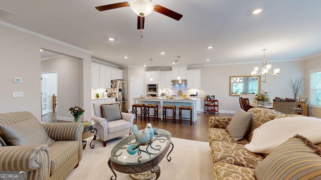 100 Maple Leaf Rd, Sharpsburg, GA 30277 - living area with a chandelier, light wood-style flooring, a ceiling fan, ornamental molding, and recessed lighting