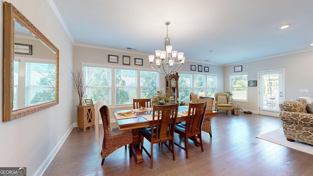 100 Maple Leaf Rd, Sharpsburg, GA 30277 - dining space featuring a chandelier, wood finished floors, and ornamental molding
