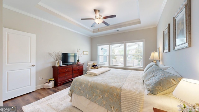 100 Maple Leaf Rd, Sharpsburg, GA 30277 - bedroom featuring a raised ceiling, wood finished floors, ornamental molding, and ceiling fan