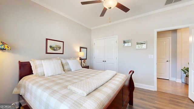 100 Maple Leaf Rd, Sharpsburg, GA 30277 - bedroom featuring wood finished floors, crown molding, a closet, ceiling fan, and lofted ceiling