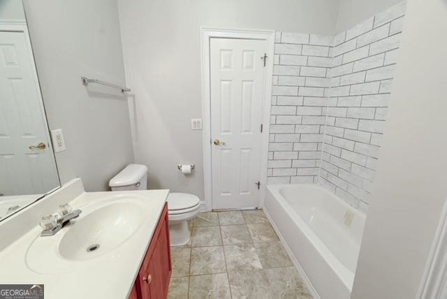 161 Pleasant Grove Rd, Mcdonough, GA 30252 - bathroom featuring toilet and vanity
