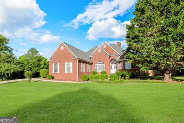 161 Pleasant Grove Rd, Mcdonough, GA 30252 - view of front of property with a front yard