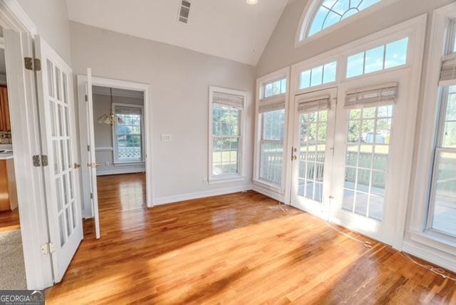 161 Pleasant Grove Rd, Mcdonough, GA 30252 - unfurnished sunroom with french doors and vaulted ceiling