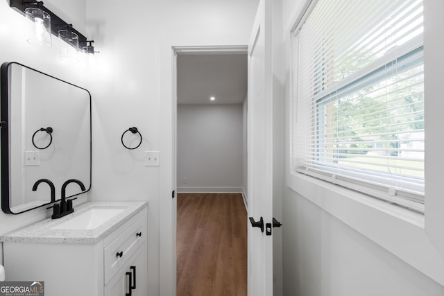 bathroom featuring vanity and wood finished floors