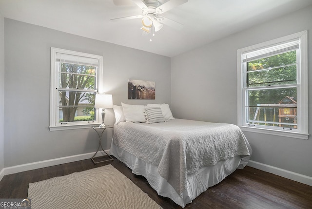 4128 Morgan Rd, Tucker, GA 30084 - bedroom with multiple windows, dark wood-style flooring, and a ceiling fan