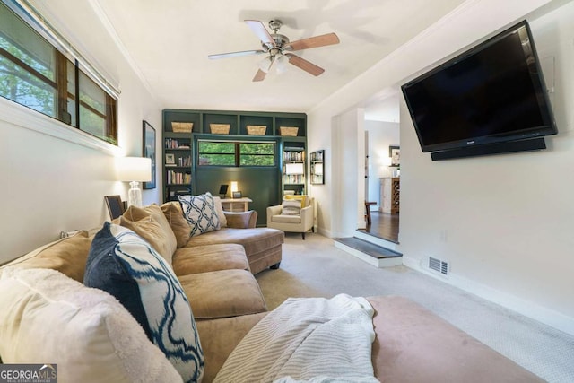 living room with carpet flooring, a ceiling fan, and baseboards