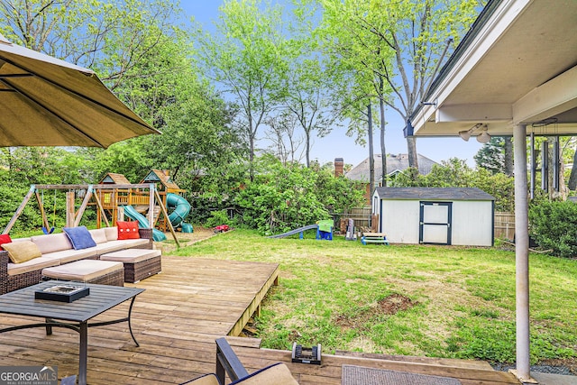 4128 Morgan Rd, Tucker, GA 30084 - wooden terrace featuring a storage unit, a playground, and a fenced backyard