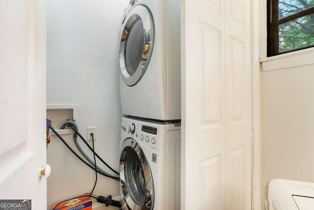 laundry room featuring estacked washer and dryer