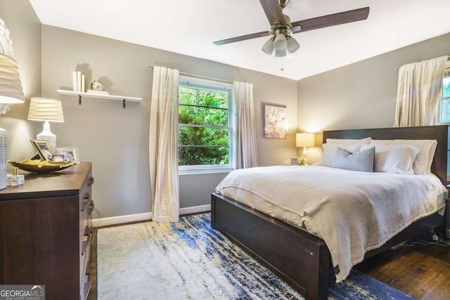 4128 Morgan Rd, Tucker, GA 30084 - bedroom featuring wood finished floors, baseboards, and a ceiling fan