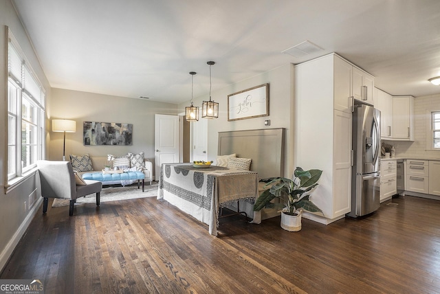 4128 Morgan Rd, Tucker, GA 30084 - dining space with dark wood-style flooring and baseboards