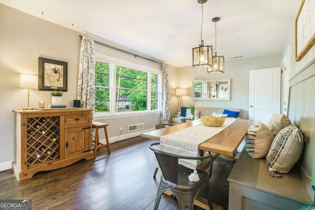 dining area with wood finished floors and baseboards